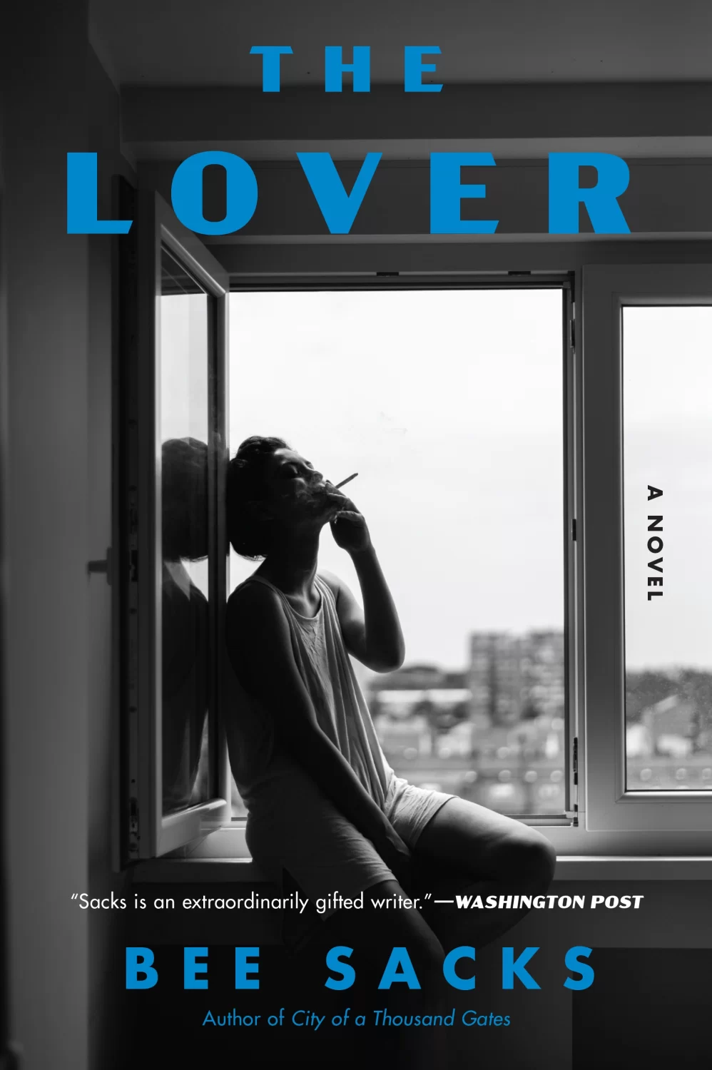 The Lover: A Novel by Bee Sacks paperback cover, featuring a young figure smoking reclining on a windowsill.